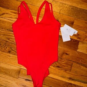 Athleta red body suite.Brand new size Medium.